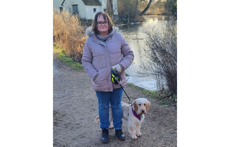 Image: Sue with her dog - Sue was supported by St Helena Hospice