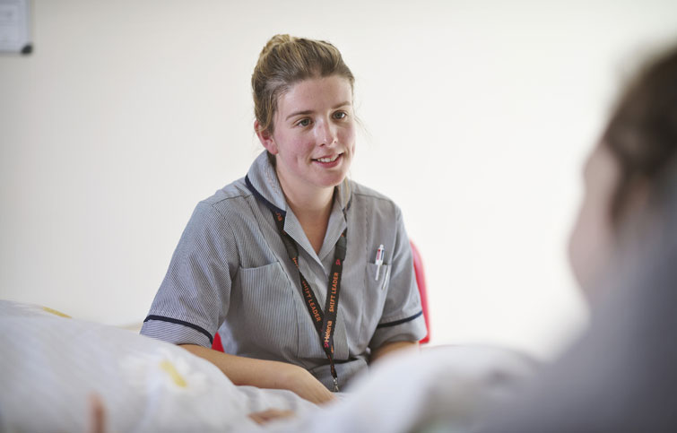 Nurse listening to patient