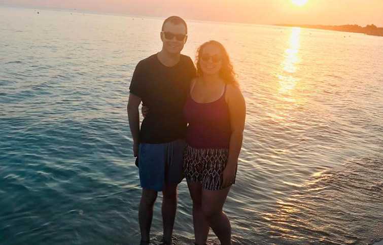 Ryan and Danielle in the sea at sunset